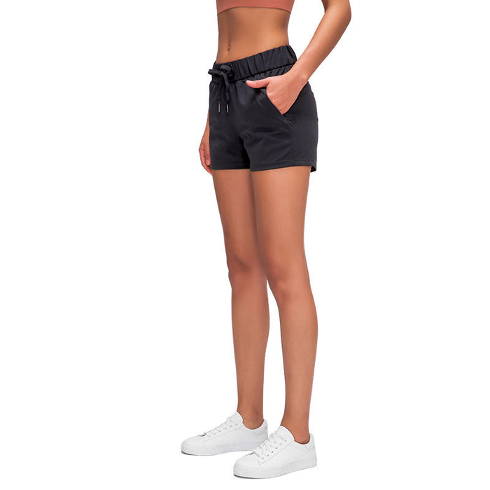 Short de sport ample en dentelle pour femme, extensible et respirant, idéal pour la gym, le yoga et autres activités physiques.