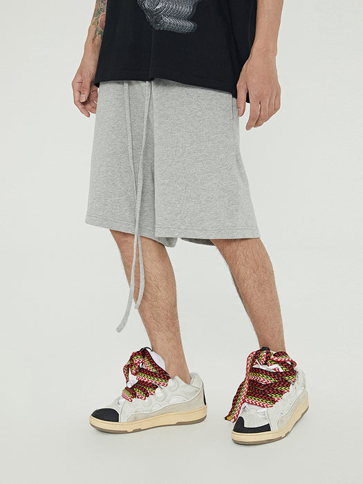 Pantalones deportivos cortos de felpa de marca de moda, holgados y combinables, con cordón y cinco puntos.