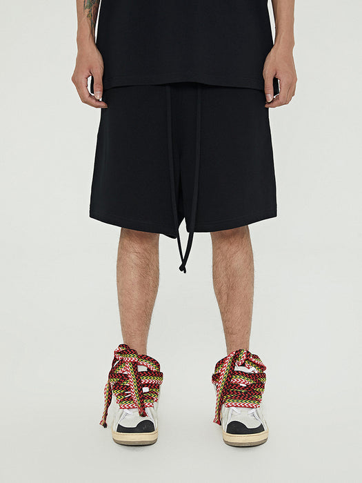 Pantalones deportivos cortos de felpa de marca de moda, holgados y combinables, con cordón y cinco puntos.