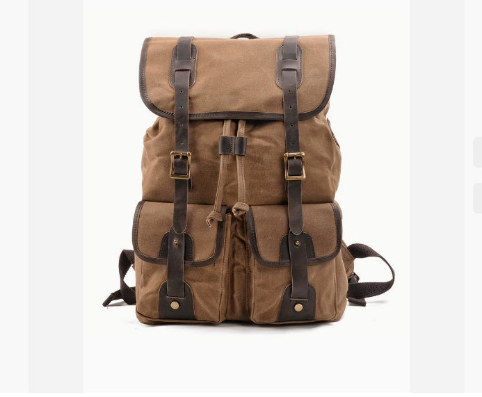 Mochila de viaje con costuras de lona y cuero de Caballo Loco