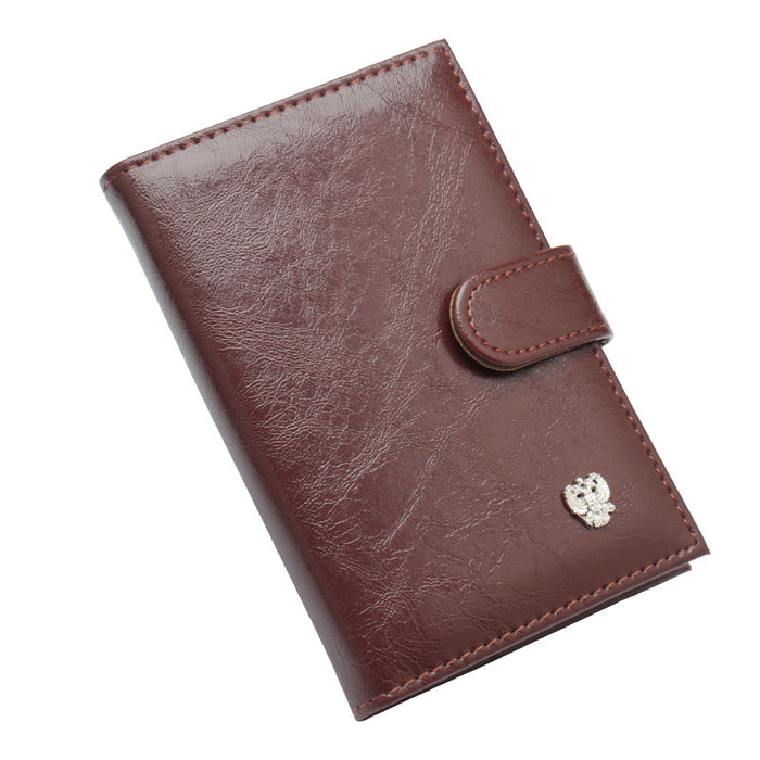 Étui à passeport double compartiment en cuir ciré à l'huile et aux ferrures décoratives