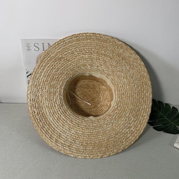 Chapeau de soleil de plage à très large bord et calotte plate en paille
