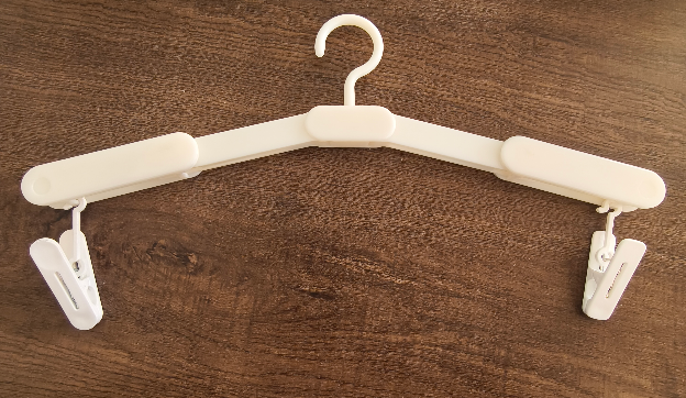 Cintre de voyage pliable - sans pinces - blanc ventre de poisson - ABS+PP - 1 pièce