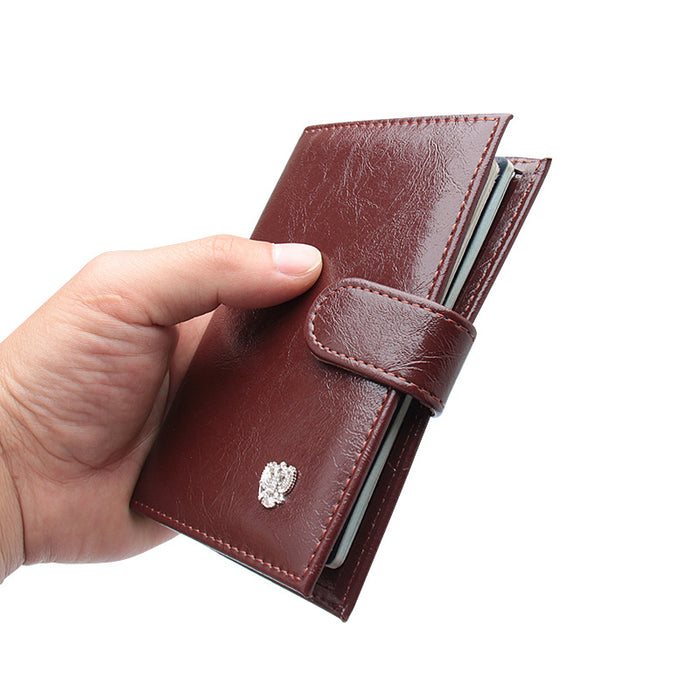 Étui à passeport double compartiment en cuir ciré à l'huile et aux ferrures décoratives